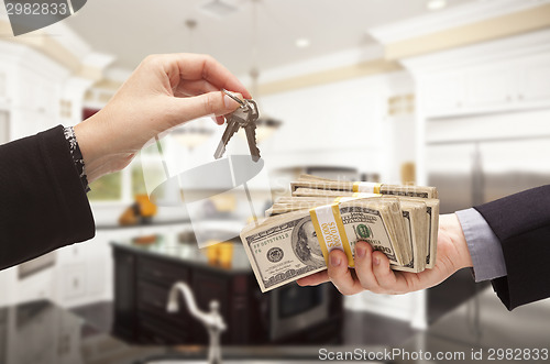 Image of Handing Over Cash for Keys Inside Beautiful Home