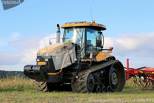 Image of Challenger Agricultural Crawler Tractor on Field in Autumn