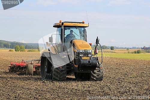 Image of Challenger Agricultural Crawler Tractor on Field in Autumn