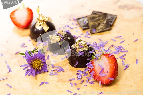 Image of dark chocolate on a wooden table.