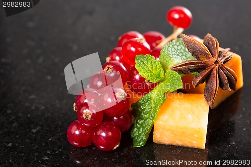 Image of Assortment of delicious cheese and fruits 