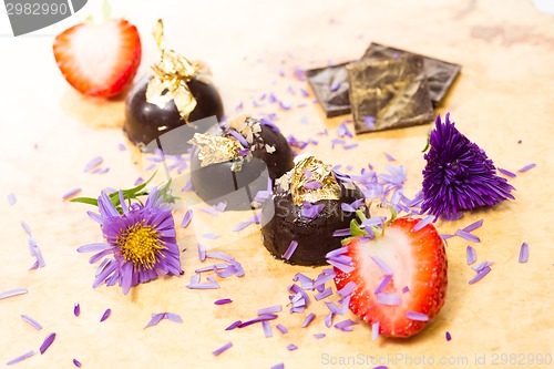 Image of dark chocolate on a wooden table.