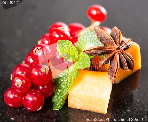 Image of Assortment of delicious cheese and fruits 