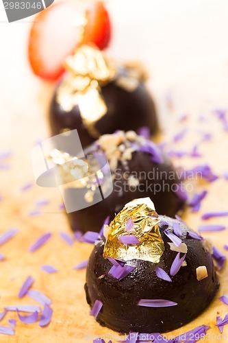 Image of dark chocolate on a wooden table.