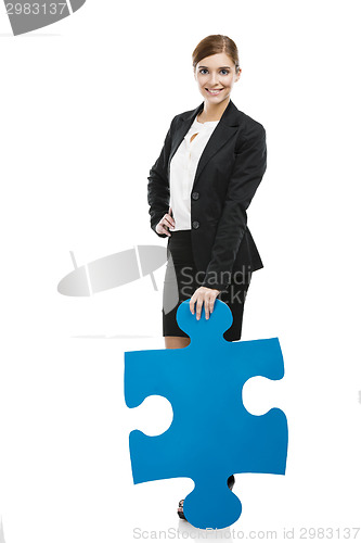 Image of Businesswoman with a puzzle piece