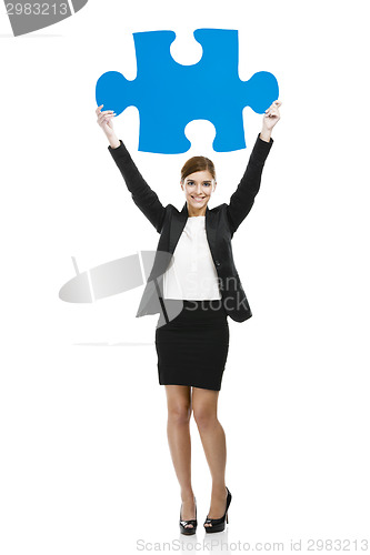 Image of Businesswoman with a puzzle piece