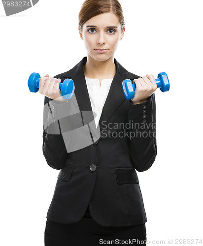 Image of Business woman lifting weights