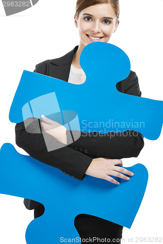 Image of Businesswoman with a puzzle piece