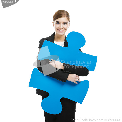 Image of Businesswoman with a puzzle piece