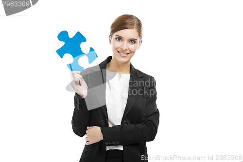 Image of Businesswoman with a puzzle piece