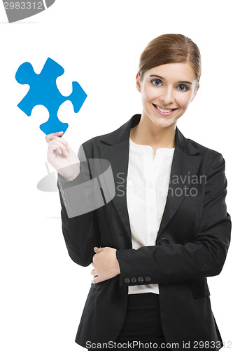 Image of Businesswoman with a puzzle piece