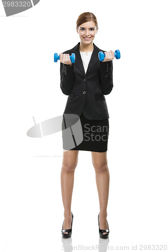 Image of Business woman lifting weights