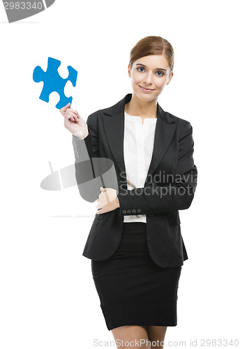 Image of Businesswoman with a puzzle piece