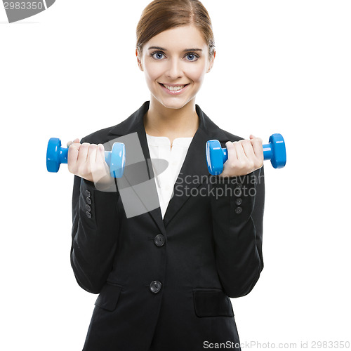 Image of Business woman lifting weights