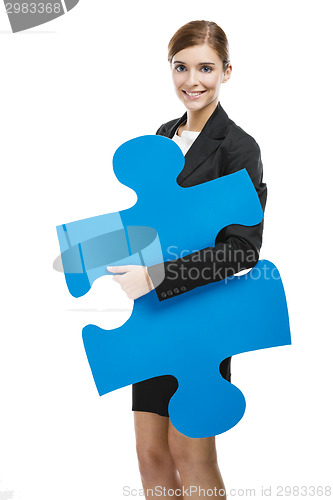 Image of Businesswoman with a puzzle piece