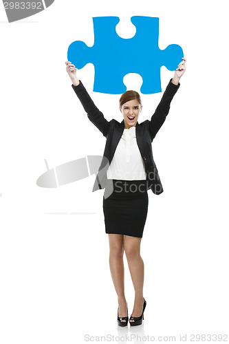 Image of Businesswoman with a puzzle piece