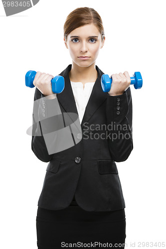 Image of Business woman lifting weights