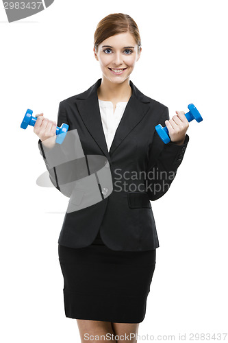 Image of Business woman lifting weights