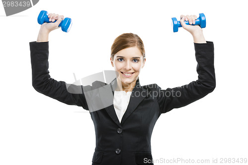 Image of Business woman lifting weights