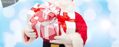 Image of close up of santa claus with gift box