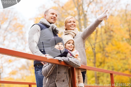 Image of happy family in autumn park