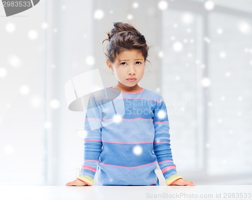 Image of sad or tired little girl indoors