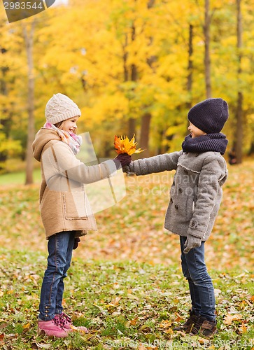 Image of smiling children in autumn park