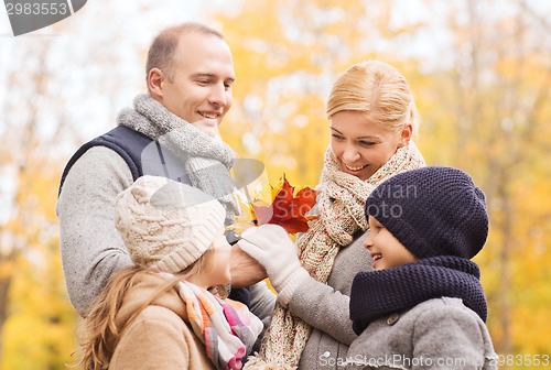 Image of happy family in autumn park