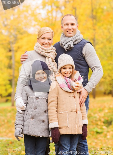 Image of happy family in autumn park
