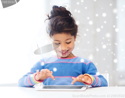 Image of smiling girl with tablet pc at home