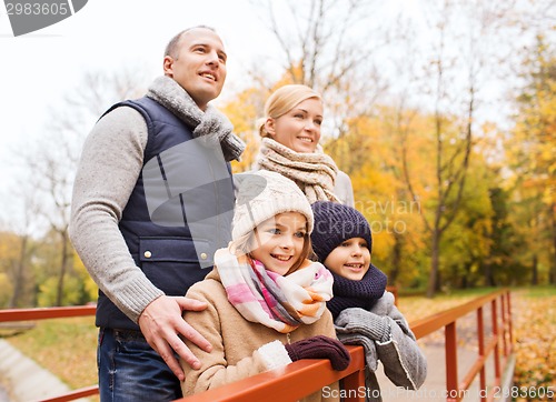 Image of happy family in autumn park