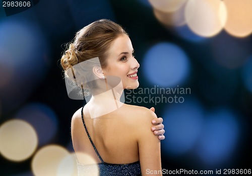 Image of smiling woman in evening dress