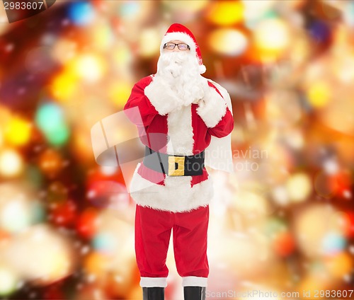 Image of man in costume of santa claus with bag