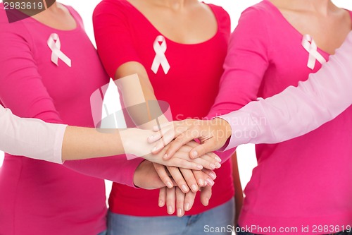 Image of close up of women with cancer awareness ribbons