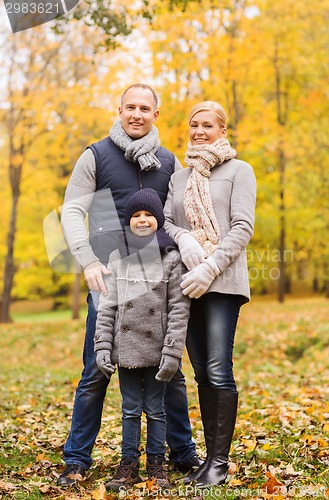 Image of happy family in autumn park