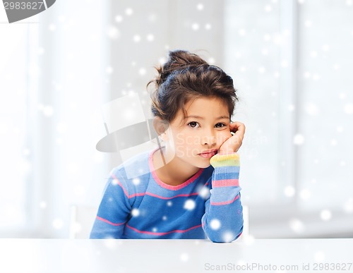Image of sad or tired little girl indoors