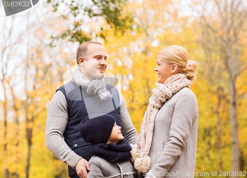 Image of happy family in autumn park