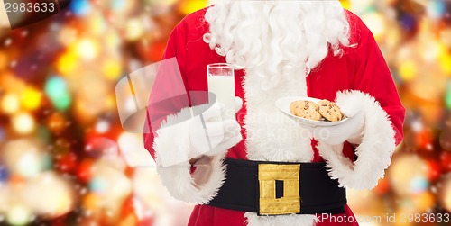 Image of santa claus with glass of milk and cookies