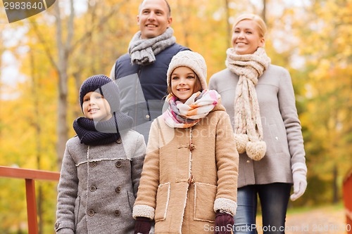 Image of happy family in autumn park