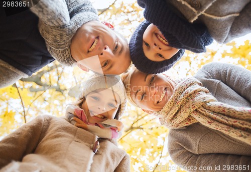 Image of happy family in autumn park