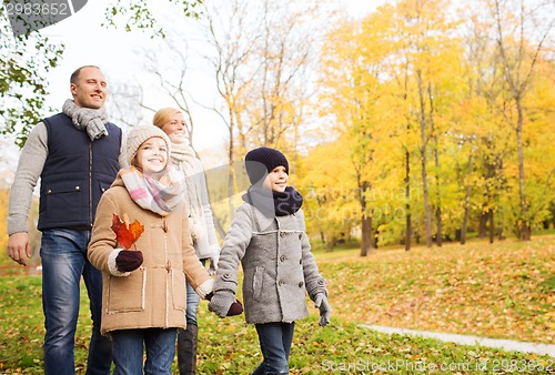 Image of happy family in autumn park