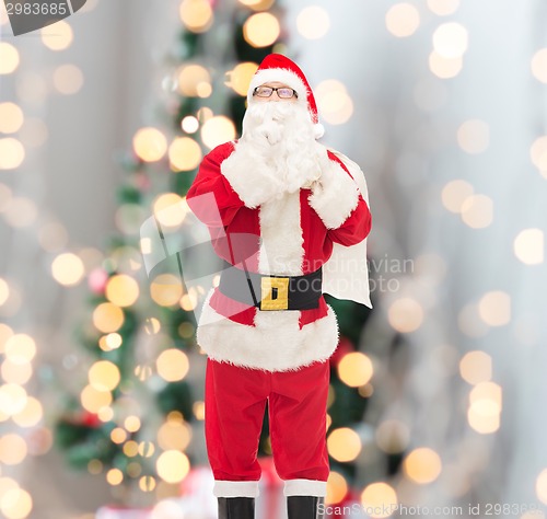 Image of man in costume of santa claus with bag