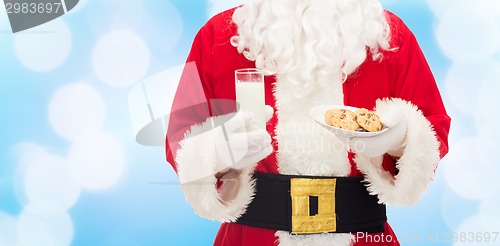 Image of santa claus with glass of milk and cookies