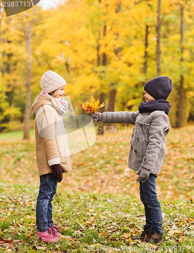 Image of smiling children in autumn park