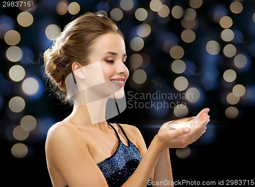 Image of smiling woman in evening dress