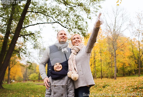 Image of happy family in autumn park