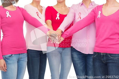 Image of close up of women with cancer awareness ribbons