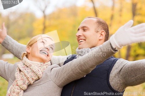 Image of smiling couple in autumn park