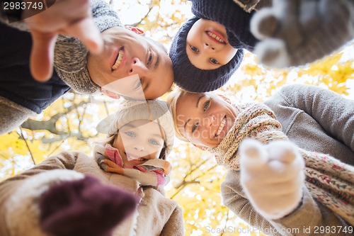 Image of happy family in autumn park