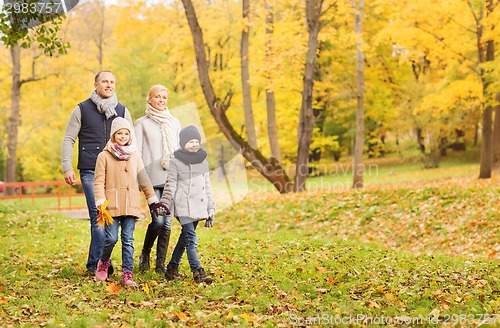 Image of happy family in autumn park